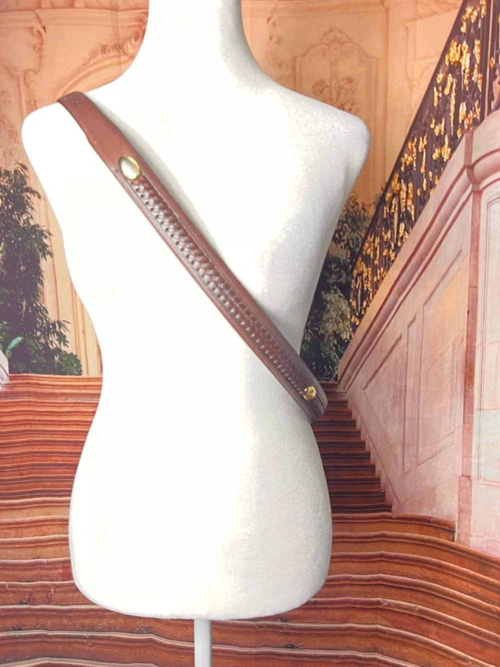 Izod Unique vintage genuine leather belt features a classic brown leather strap